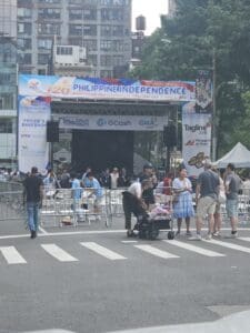 A group of people standing around in front of an event.