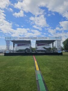 A stage with two levels and a rainbow strip in the middle.