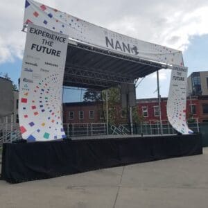 A stage with an event name on it.